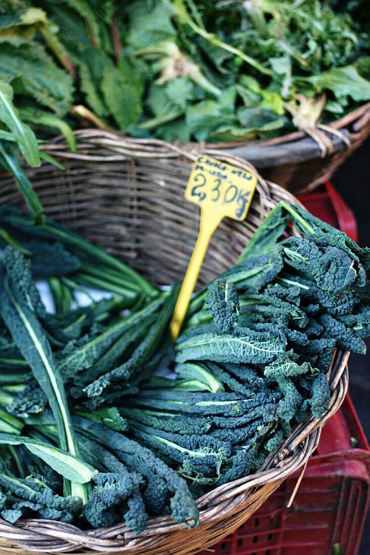 A basket of black cabbage at a market