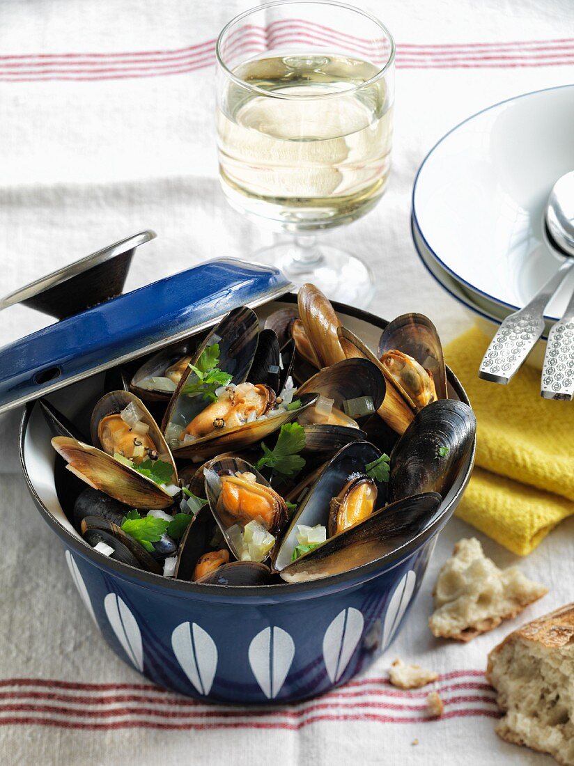 Mussels in a white wine broth with parsley and shallots