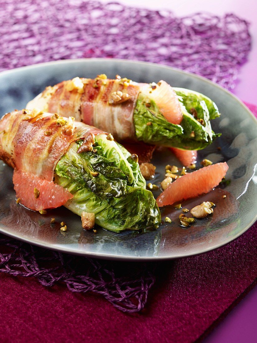 Braised cos lettuce wrapped in bacon with grapefruit