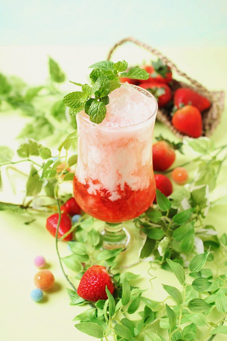 Strawberry yoghurt drink with ice cubes