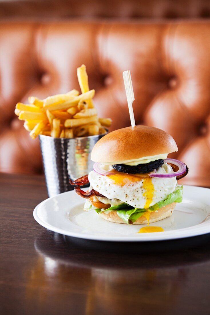 A full English breakfast burger in a restaurant