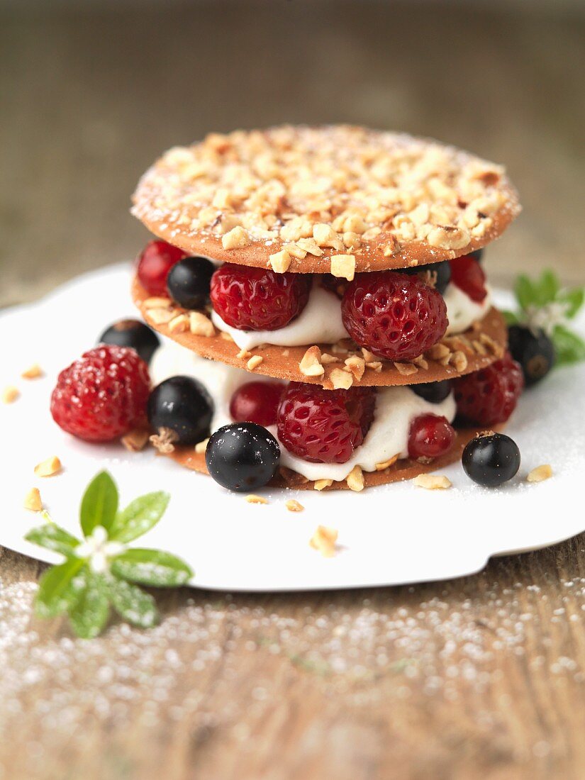 Mille feuilles with hazelnuts, berries and woodruff