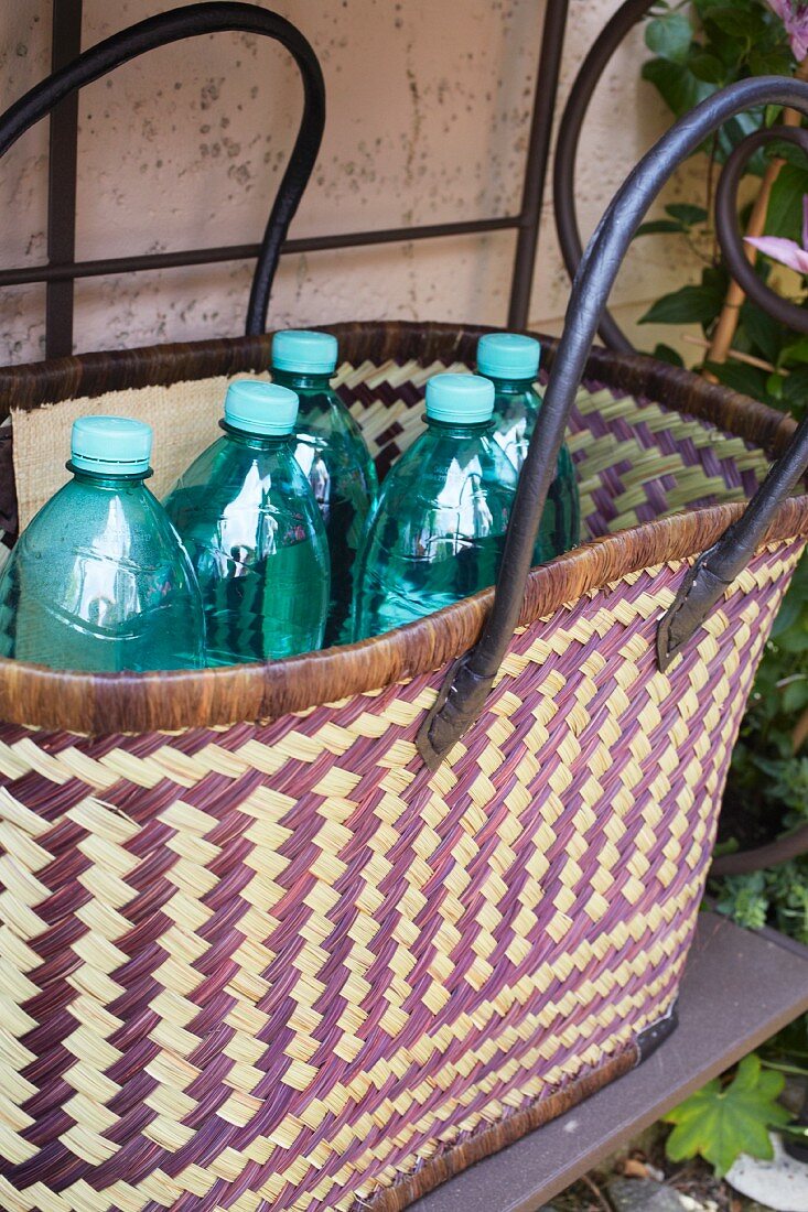 Plastic bottles in a woven bag