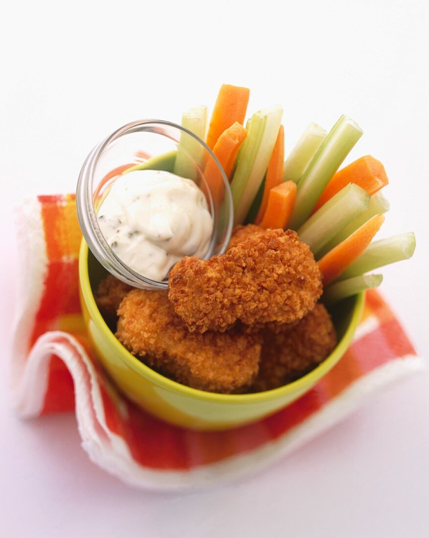 Chicken nuggets with vegetable sticks and a mayonnaise dip