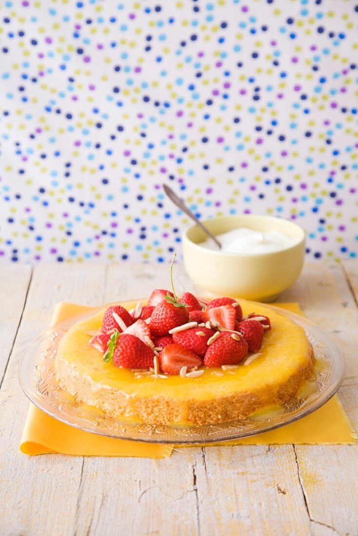 Sponge cake with strawberries with orange syrup