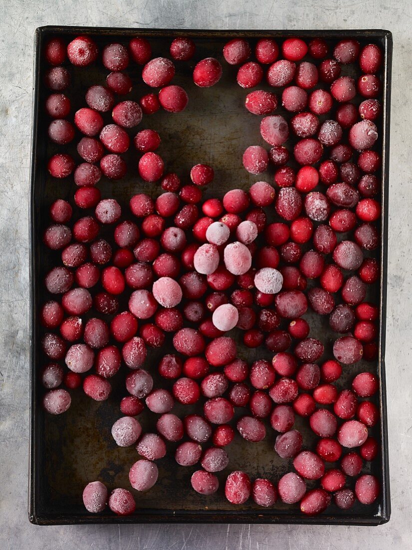 Frozen cranberries on a baking tray