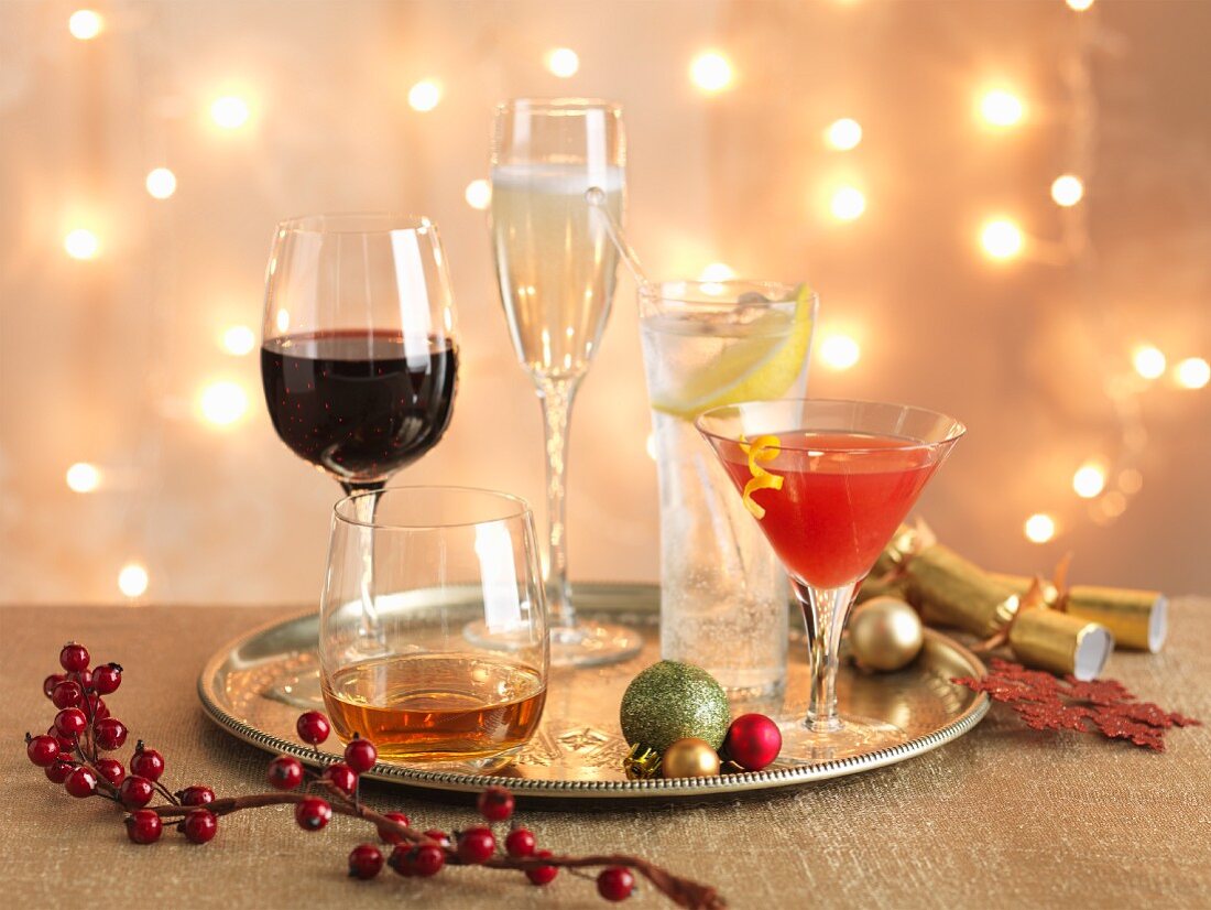 Various Christmas cocktails on a tray