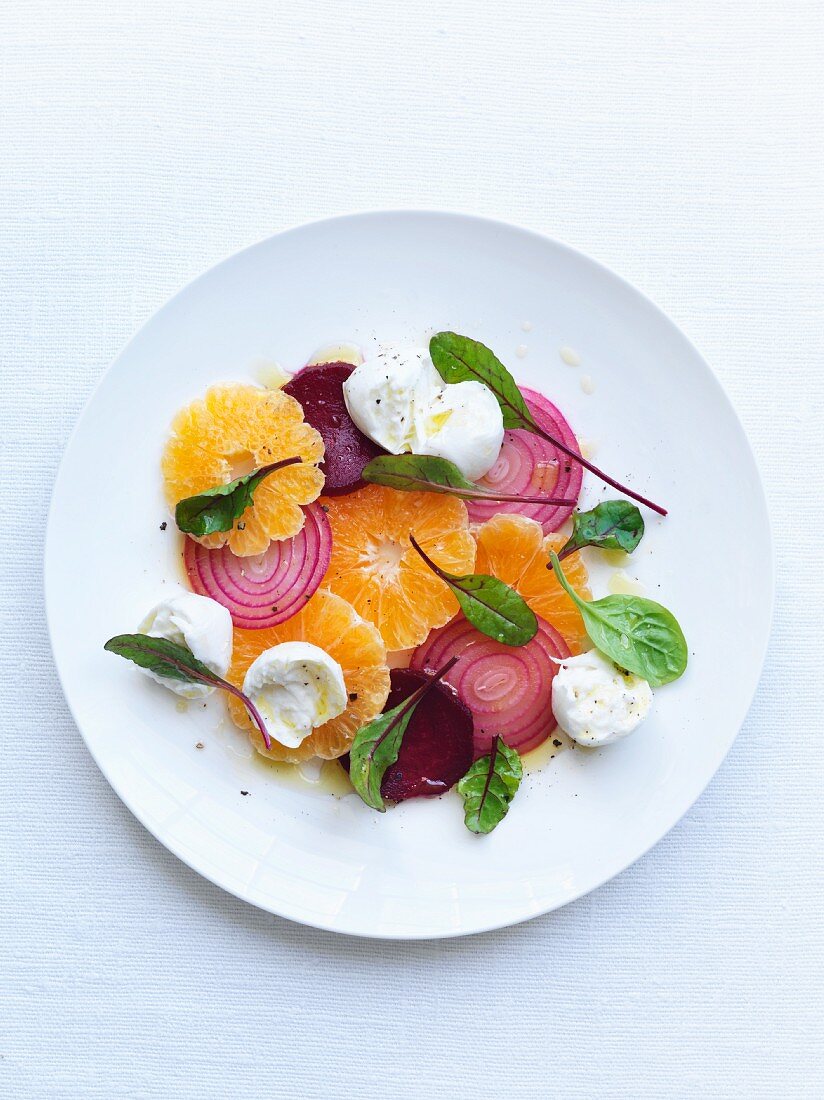 Orange and beetroot salad with red onions and young chard leaves