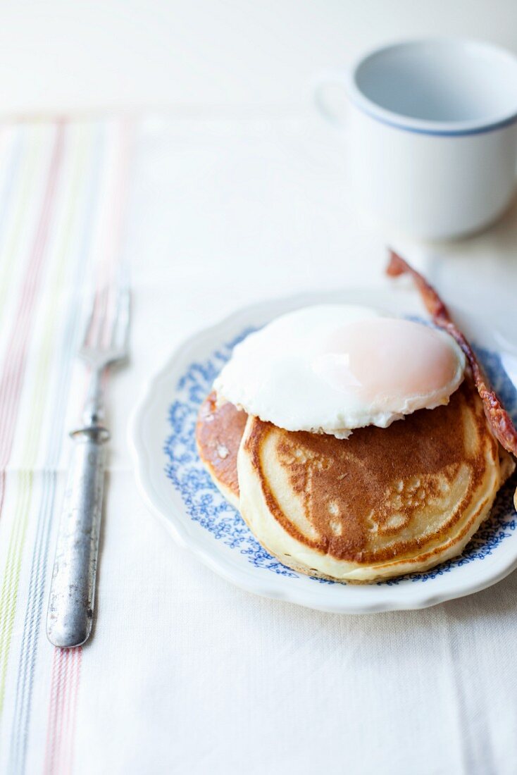 American pancakes with a poached egg