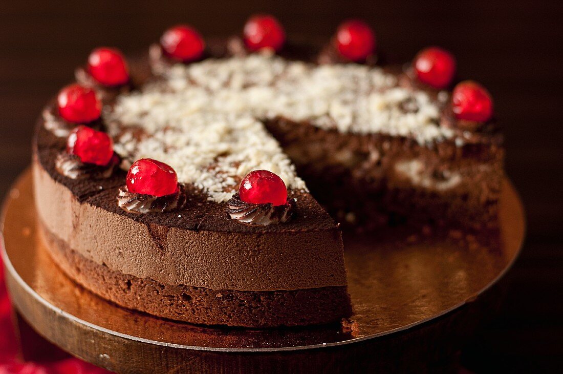 Black Forest Gateau with glace cherries, sliced