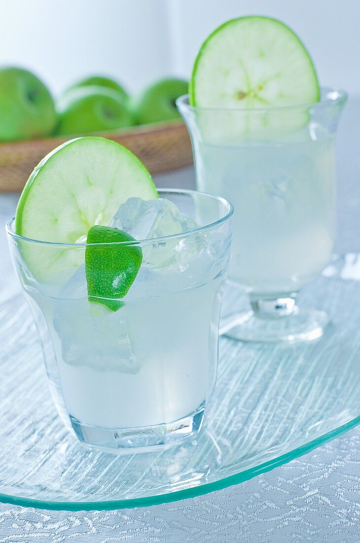 Gin with apple, lime and ice cubes