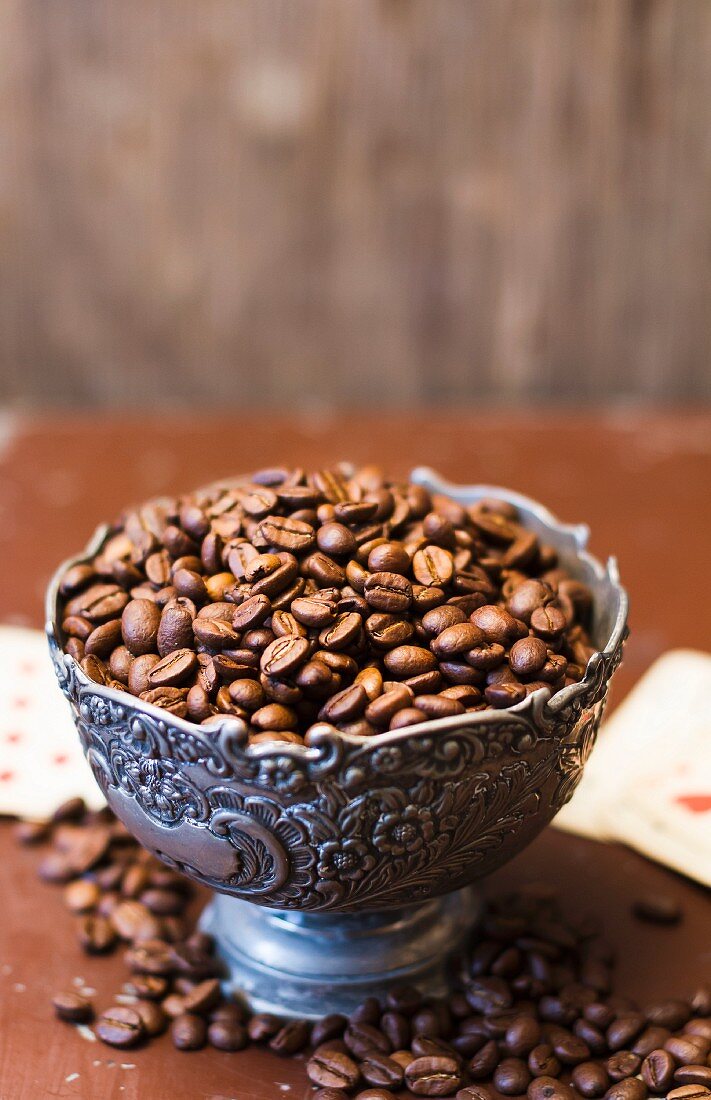 Coffee beans in metal bowl