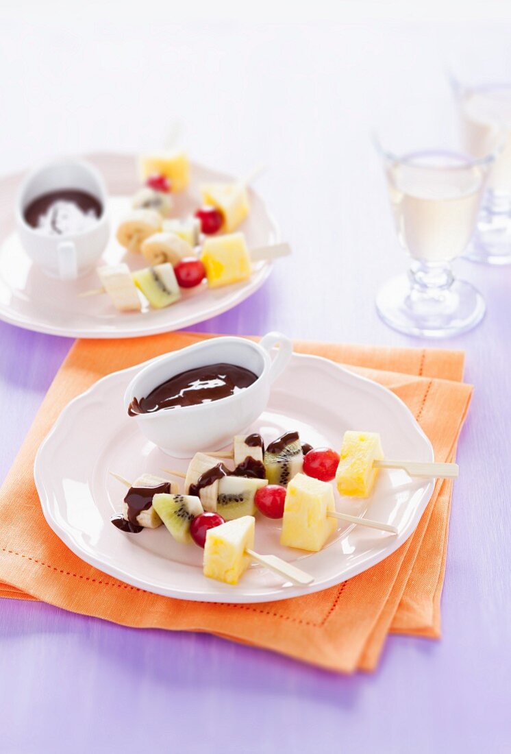 Fresh fruit skewers with chocolate sauce