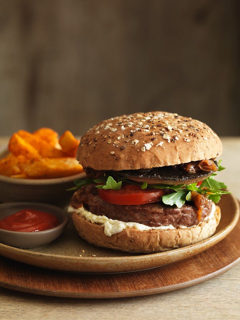 Portobello hamburger with chips and ketchup