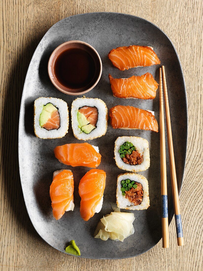 Various types of sushi made with fresh salmon and smoked salmon