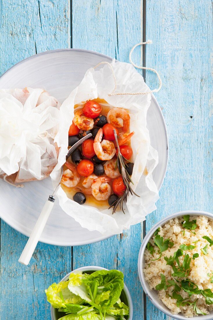 Mediterranean prawns with cherry tomatoes and olives in parchment paper