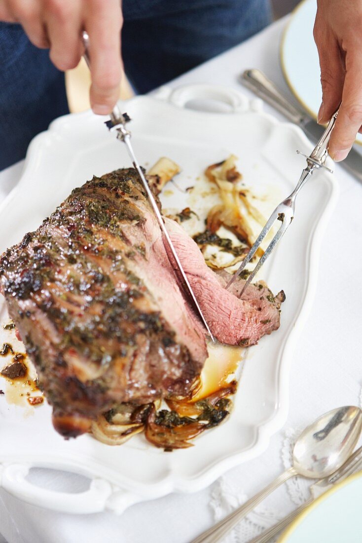 Roast lamb being carved