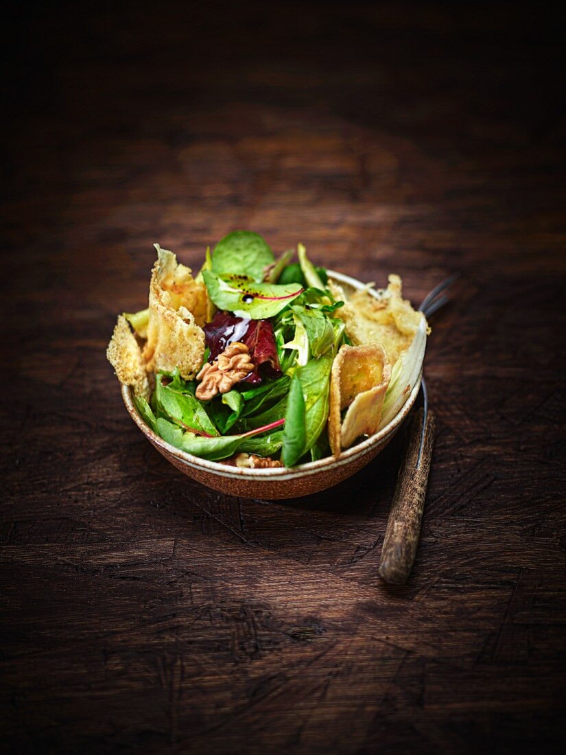 Mixed leaf salad with nuts, cheese crisps, herbs and vinaigrette