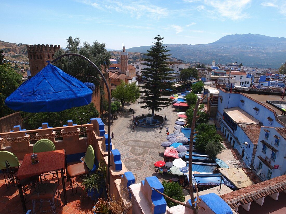 A view from a roof terrace overlooking Uta el-Hammam Square in Chefchaouen, Morocco