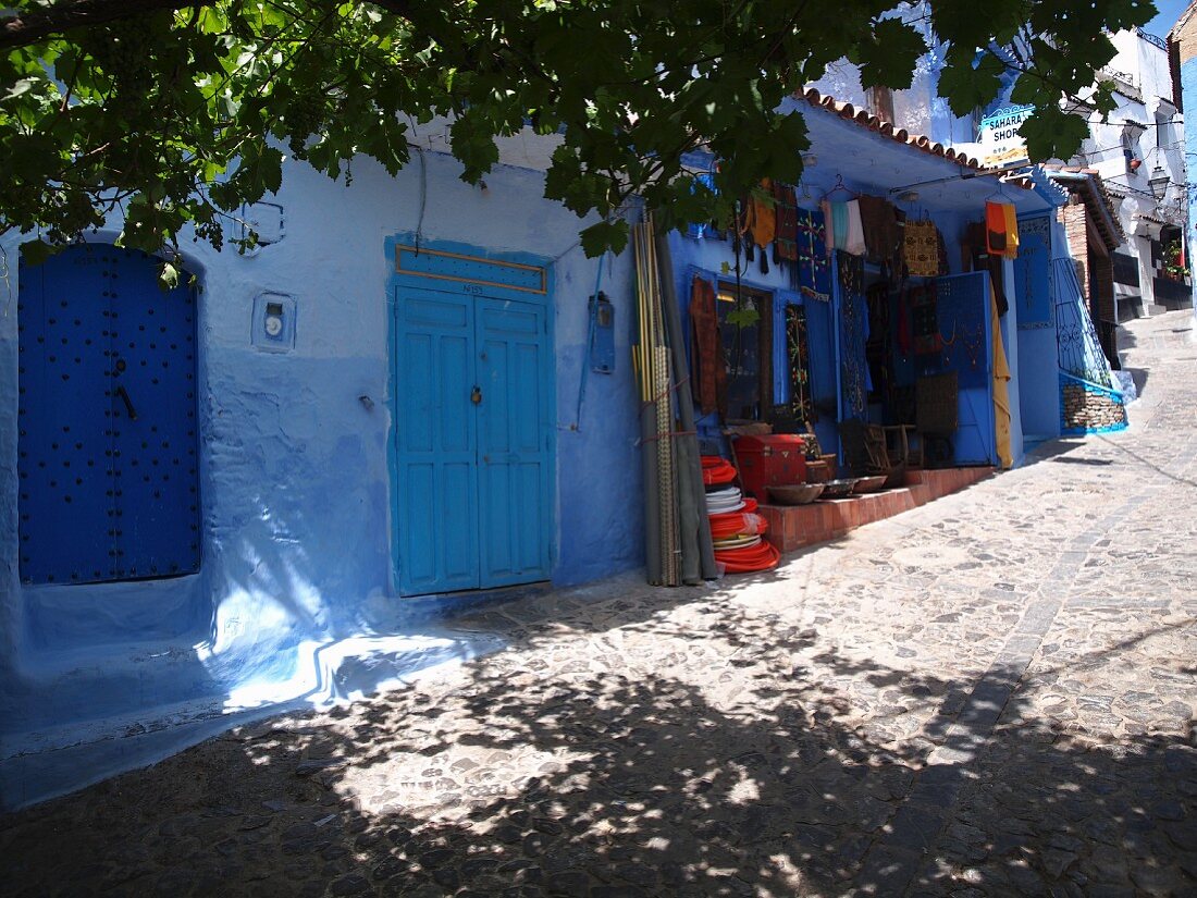 A shop set up in one of the blue alleyways of Chefchaouen, Morocco