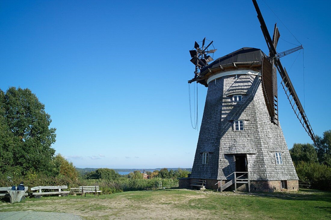 A Dutch windmill in Benz with a view of the Schmollensee lake, Usedom