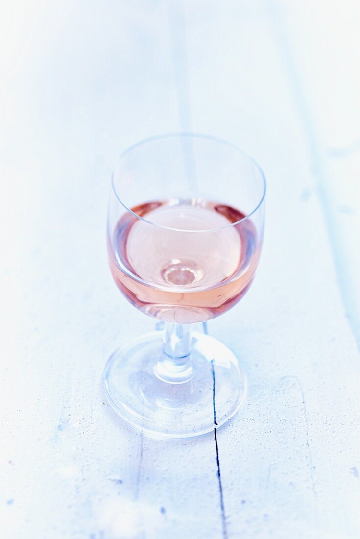 A glass of rosé wine