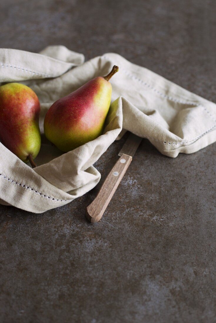 Two pears on a linen napkin