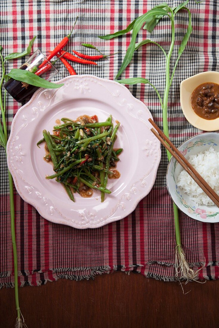 Fried water spinach with bean paste and rice (Thailand)