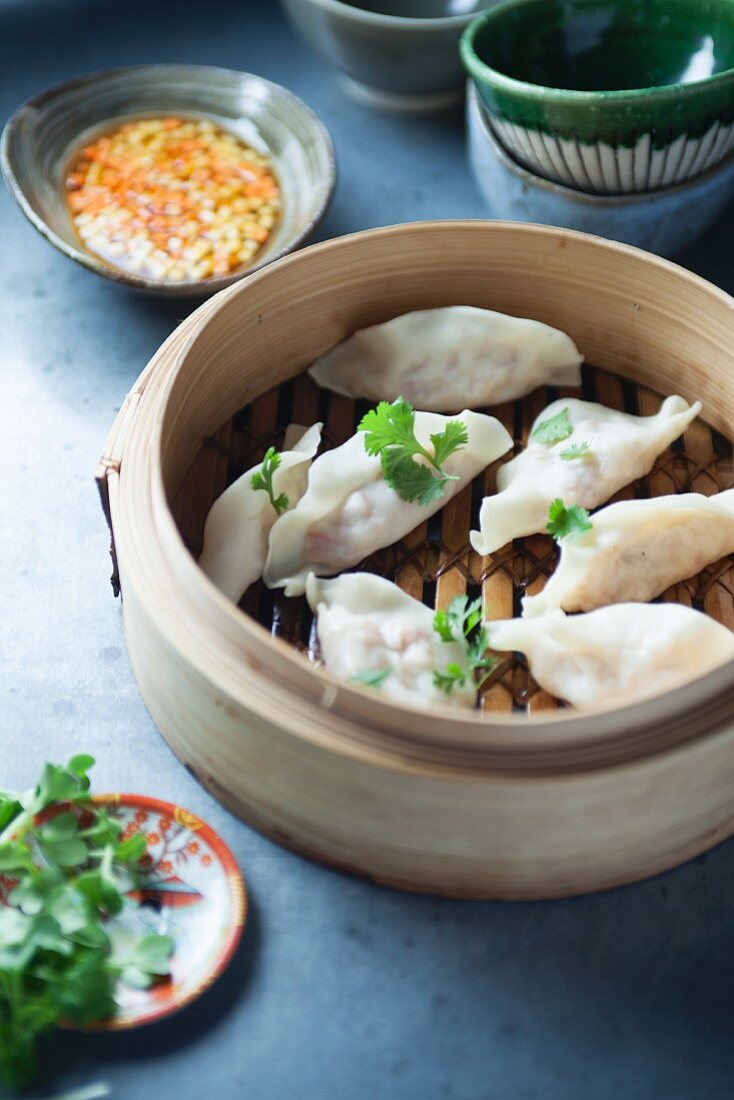 Dim sum filled with lobster in a bamboo steamer