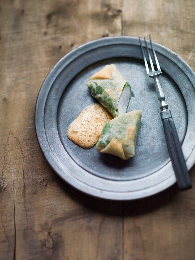 Cabbage wraps with zander and a foamy sauce