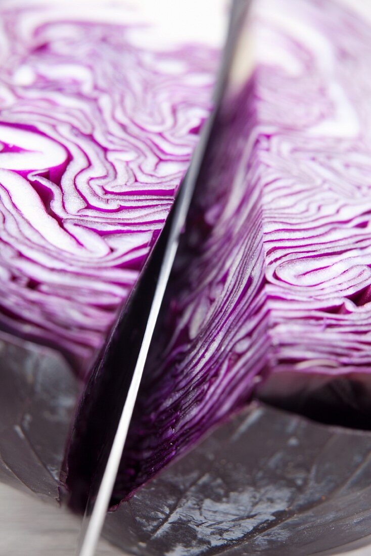 Sliced red cabbage with a knife