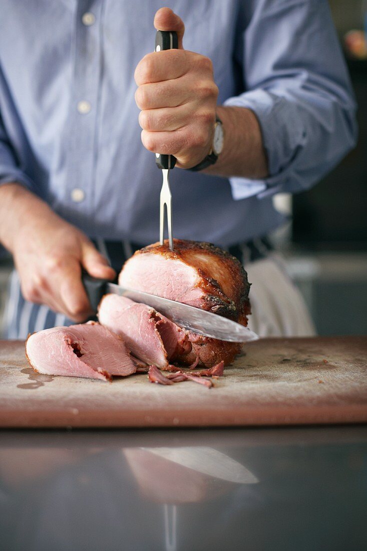 Roast ham being sliced