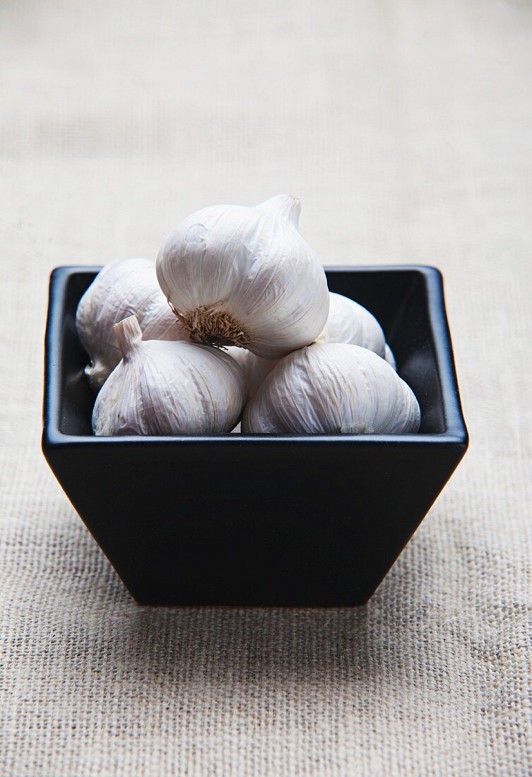 A bowl of garlic bulbs