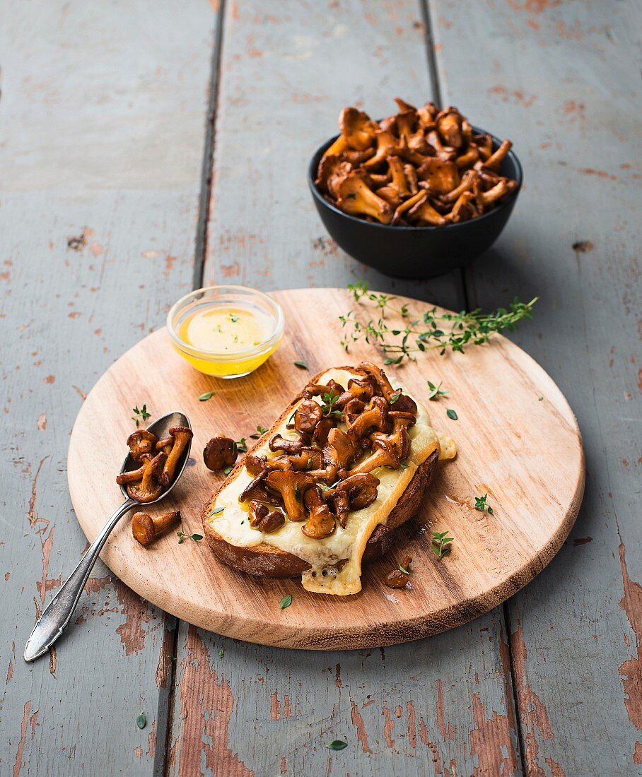 A slice of toast topped with mushrooms and cheese