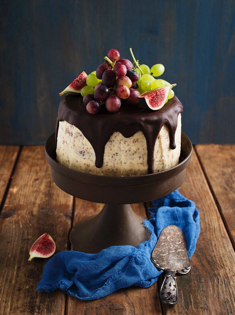 Chocolate layer cake with figs and grapes