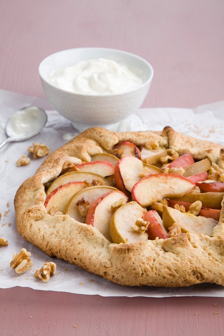 Apple and pear tart with walnuts and cream