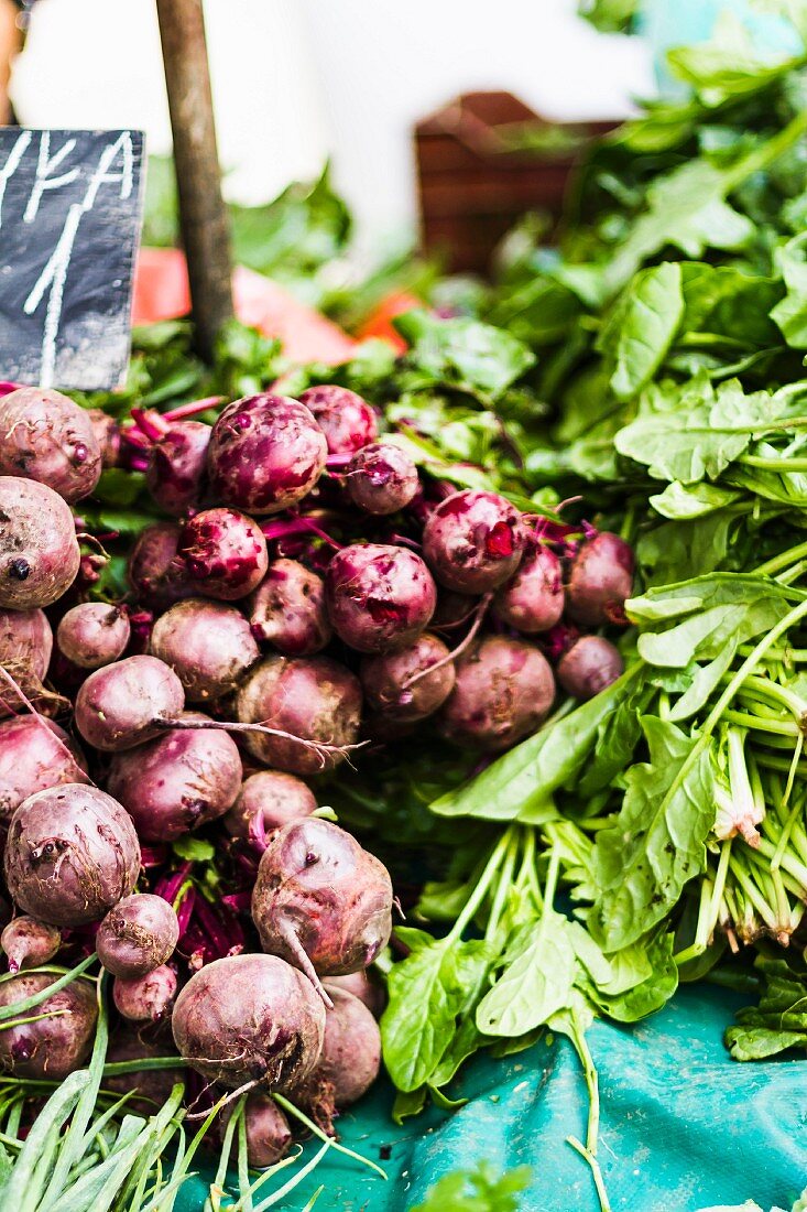 Piles of fresh beetroot on a market stand