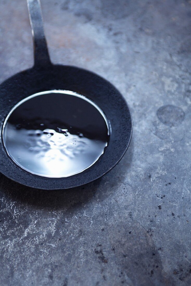 Oil in a cast-iron pan