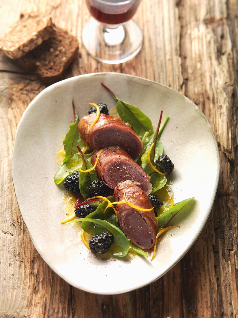 Saddle of wild hare wrapped in ham with mulberries