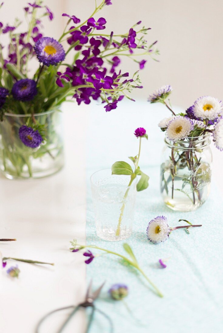 Arrangements of spring flowers on table