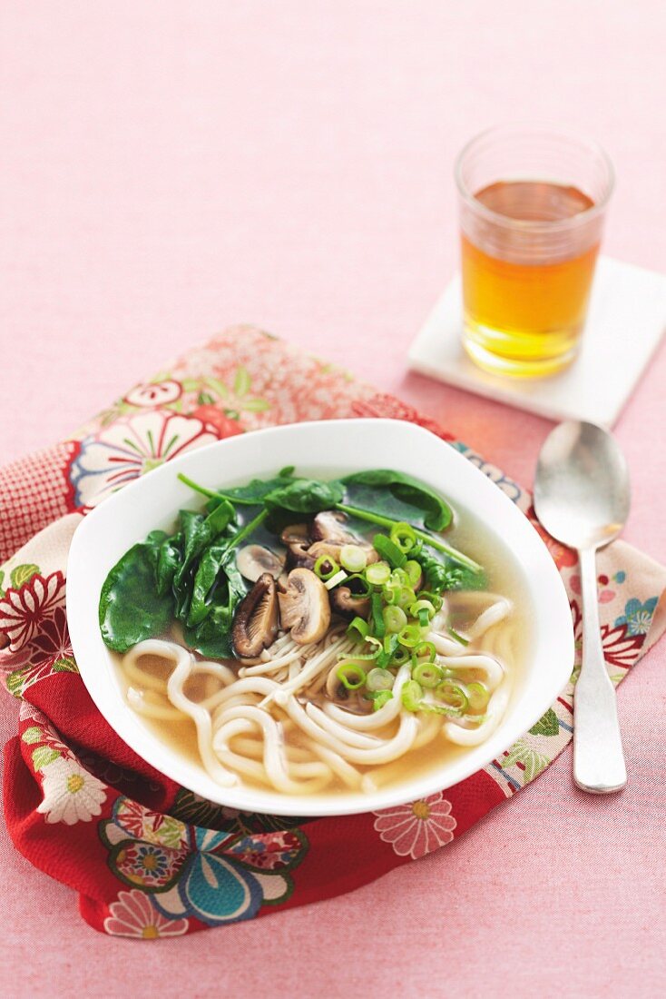 Miso soup with mushrooms, spinach and udon noodles