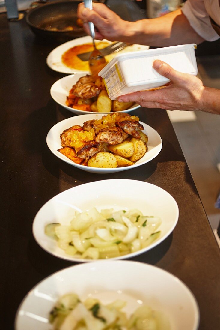 Dishes ready to be served on a counter in a restaurant