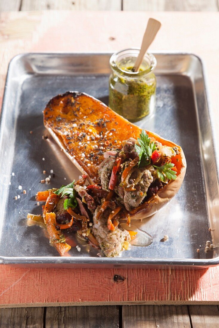 Roasted rump steak with smoked goose and chimichurri on a butternut squash