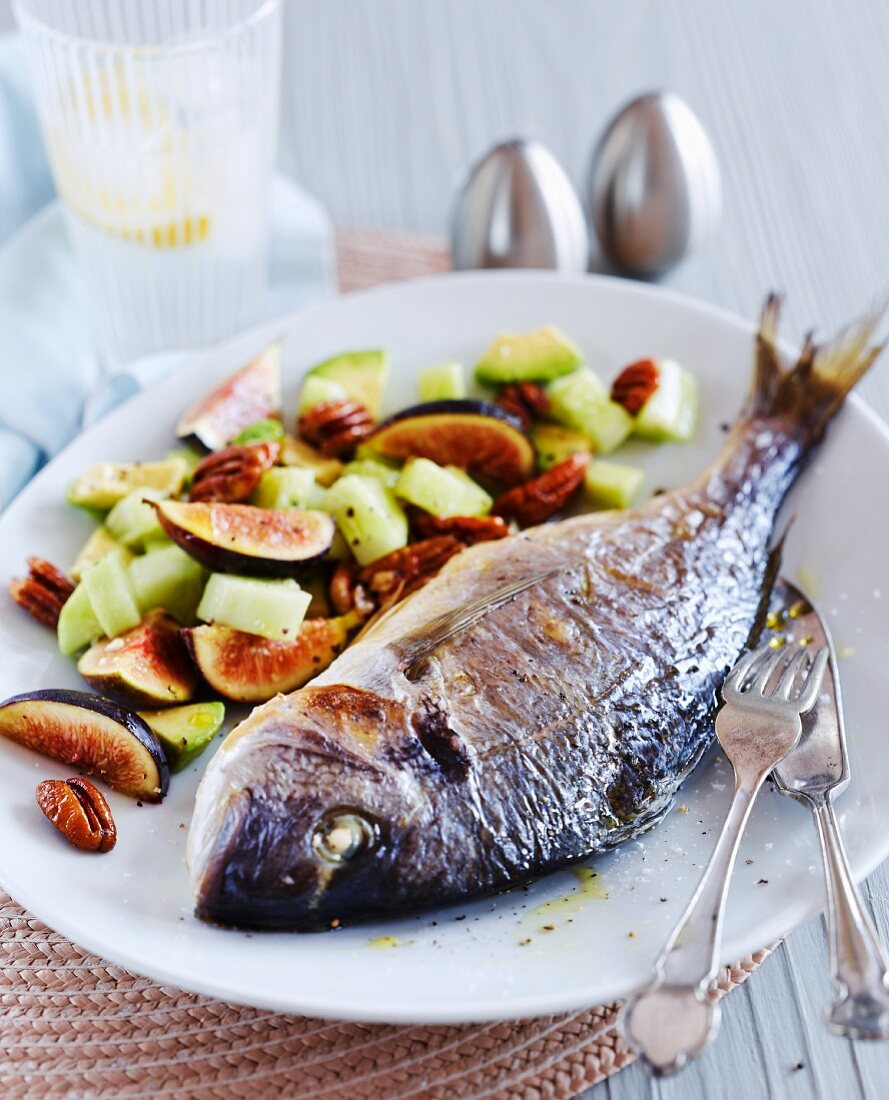 Crispy baked sea bream with cucumbers, figs and pecan nuts