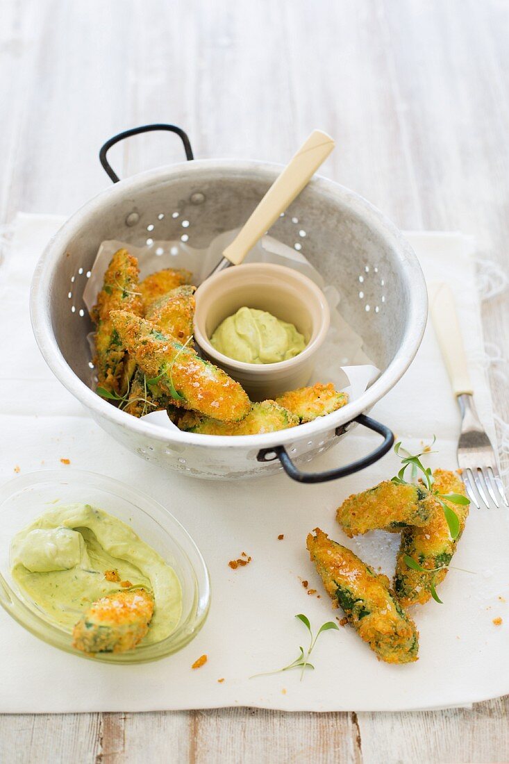Breaded and fried courgettes with cress and an avocado and yoghurt dip with horseradish