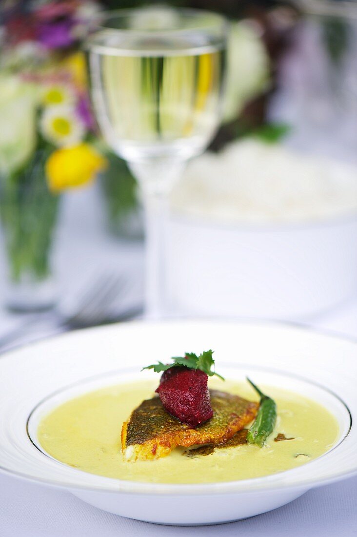 Creamy soup with fried zander and beetroot dumplings