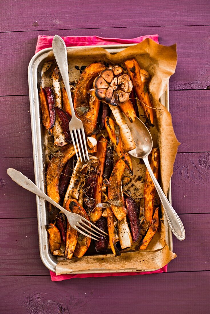 Oven-roasted vegetables on a baking tray