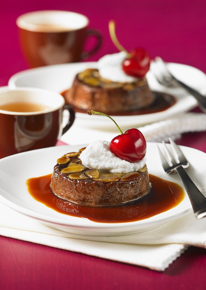 Chocolate and caramel flans with almonds and cherries