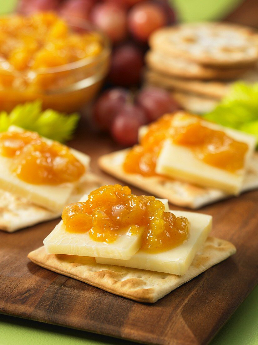 Crackers with cheese and peach chutney