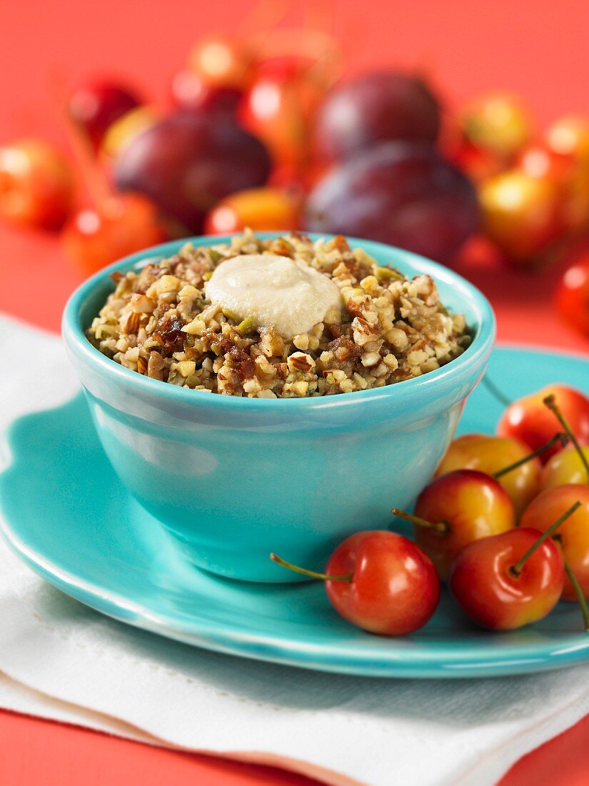 Plum and cherry muesli with chopped nuts and date purée